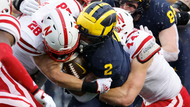 Blake Corum and Luke Reimer and Garrett Nelson 2022 Nebraska vs Michigan football USATSI_19418591